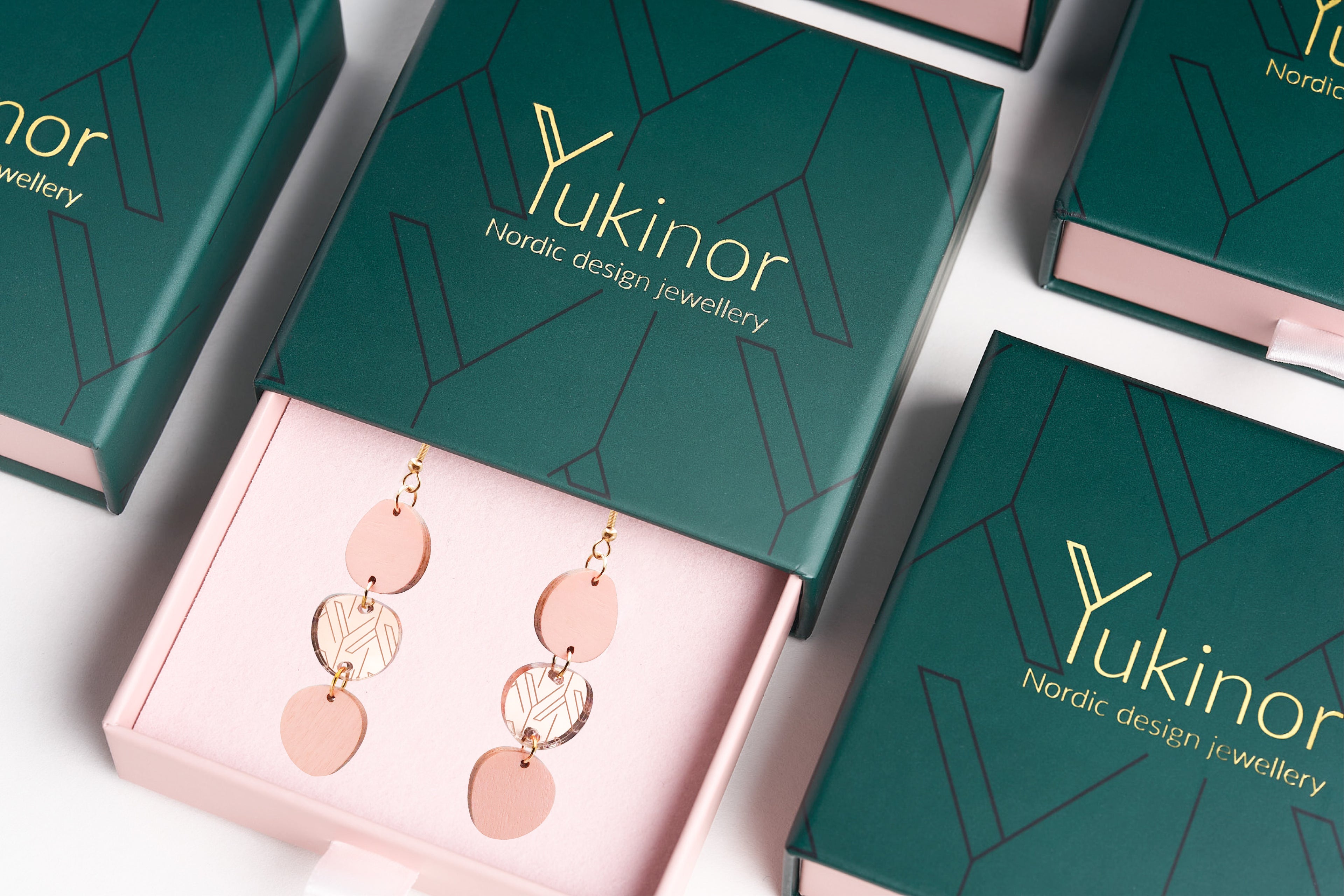 Yukinor Kawa Nordic design earrings and jewellery packages on a table. 